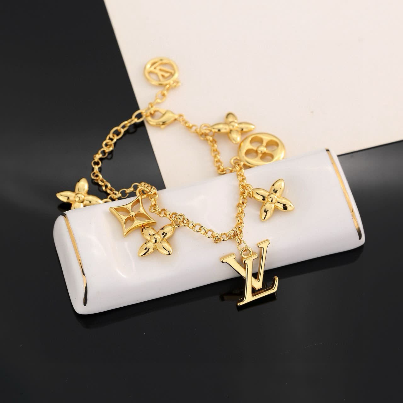 Louis Vuitton Gold Tone Bracelet with Charms